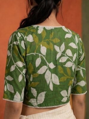 Hand Batik Light Green Color  Leaf Motif All Over Glass Sleeve Blouse in Malai Cotton silk with Lace details.